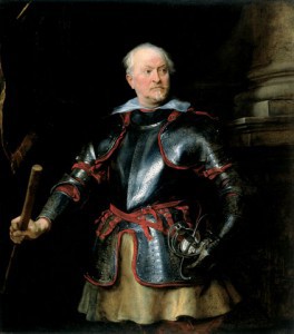 a man standing proudly is a suit of armor