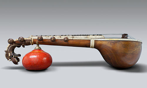 wooden sitar with dragon head and large red gourd resonator