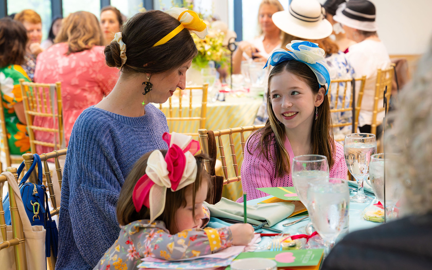 A white mother and her daughter smile for the camera