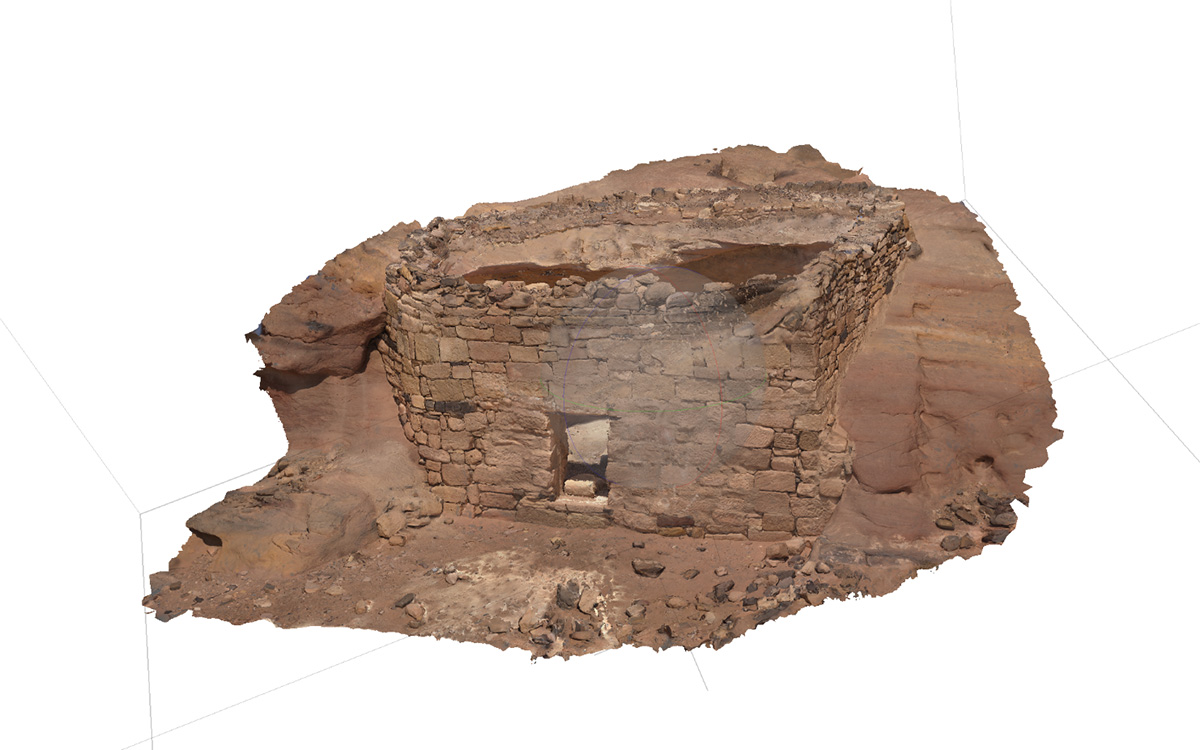 Brown 3-D rendering of rock wall with a small doorway built into the side of a brown rock formation.