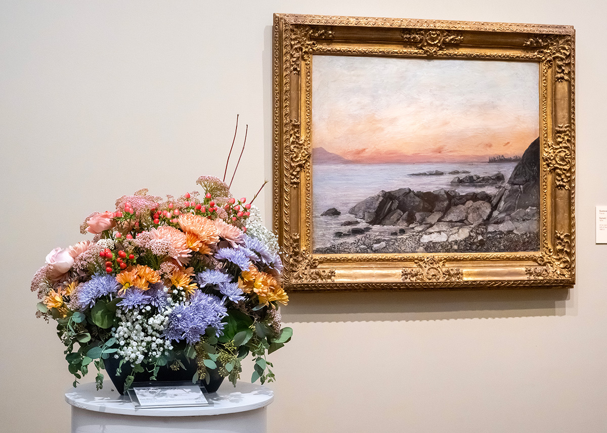 A pink and blue floral arrangement beside Sunset, Veyey, Switzerland