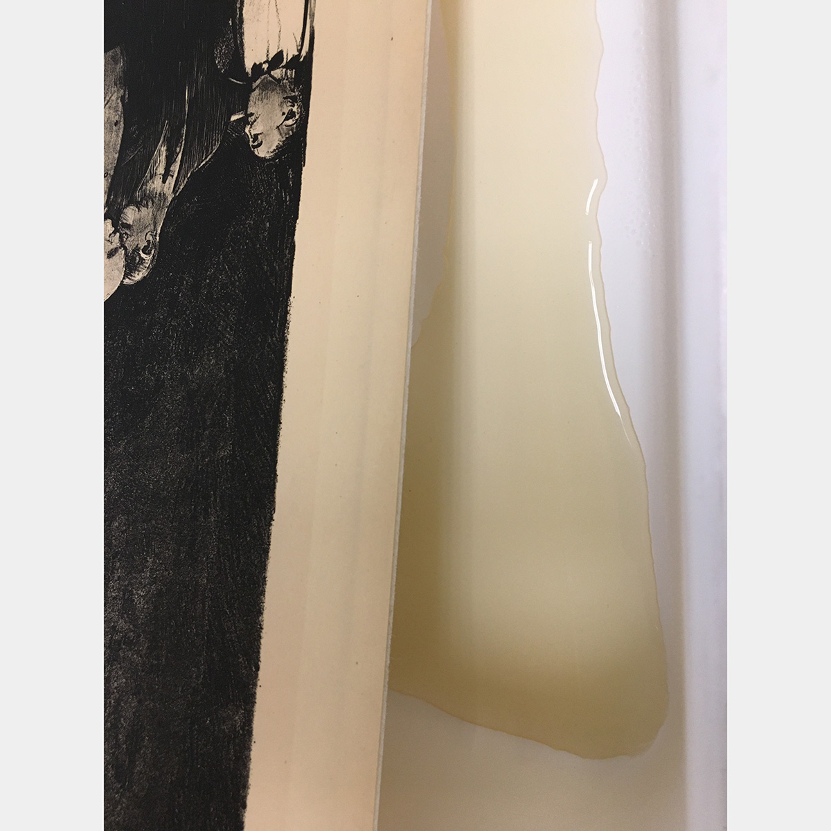 Yellow liquid runs off the side of the print