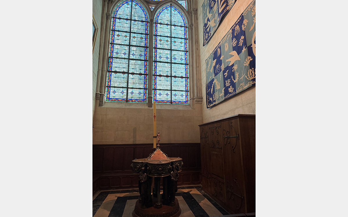 Stained glass and tapestries inside a chapel