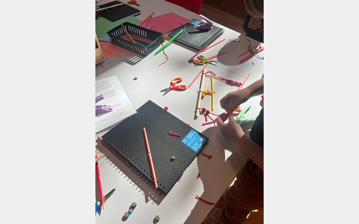 Tabletop with art supplies and sketchbook