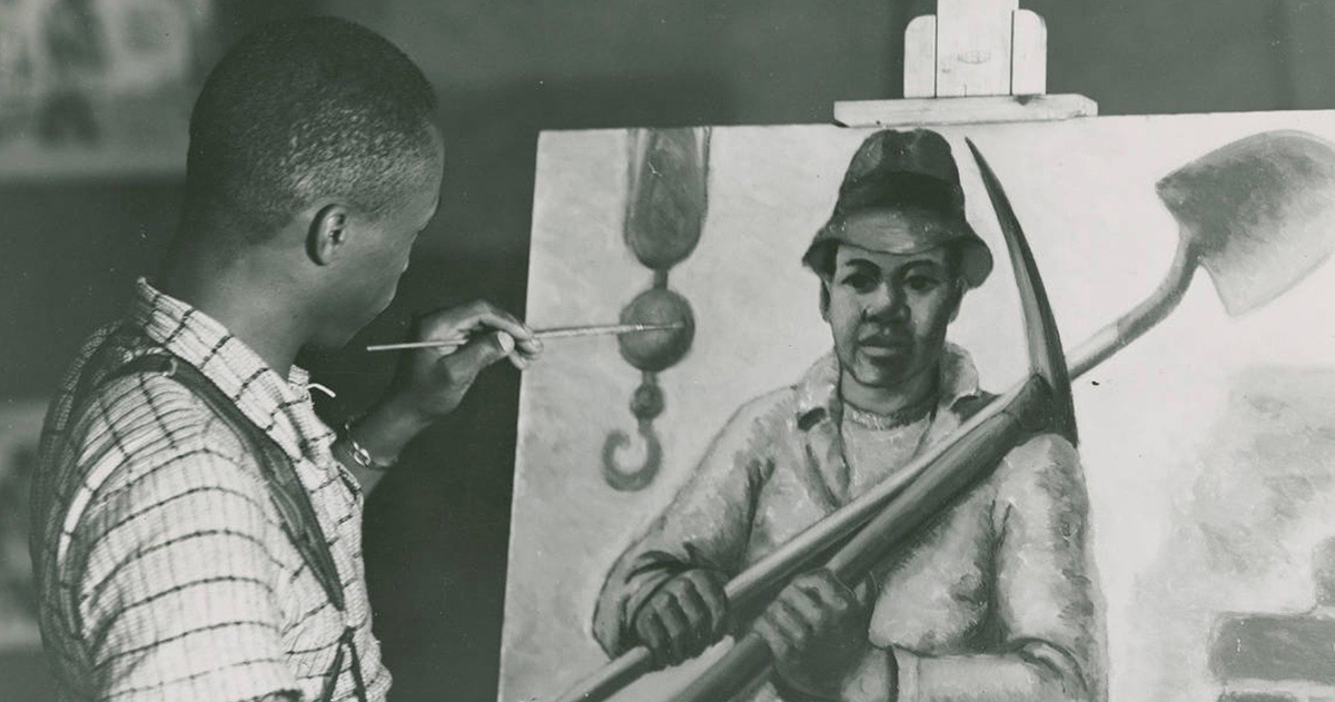 John C. Lutz putting the finishing touches to his painting