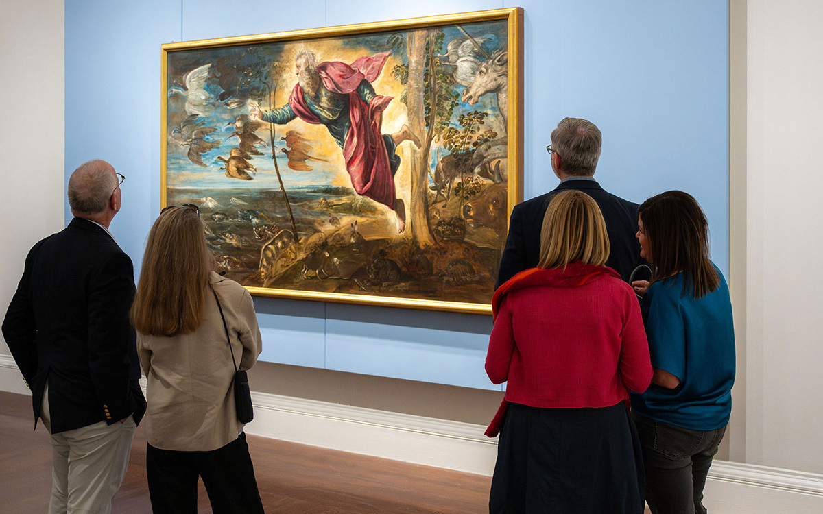 A group of white people look at a large painting of a glowing white perosn