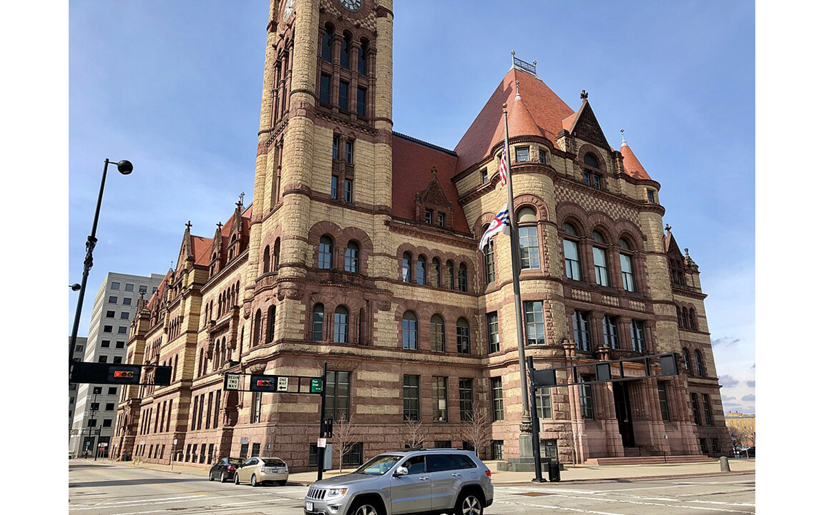 Large stone building with red roof