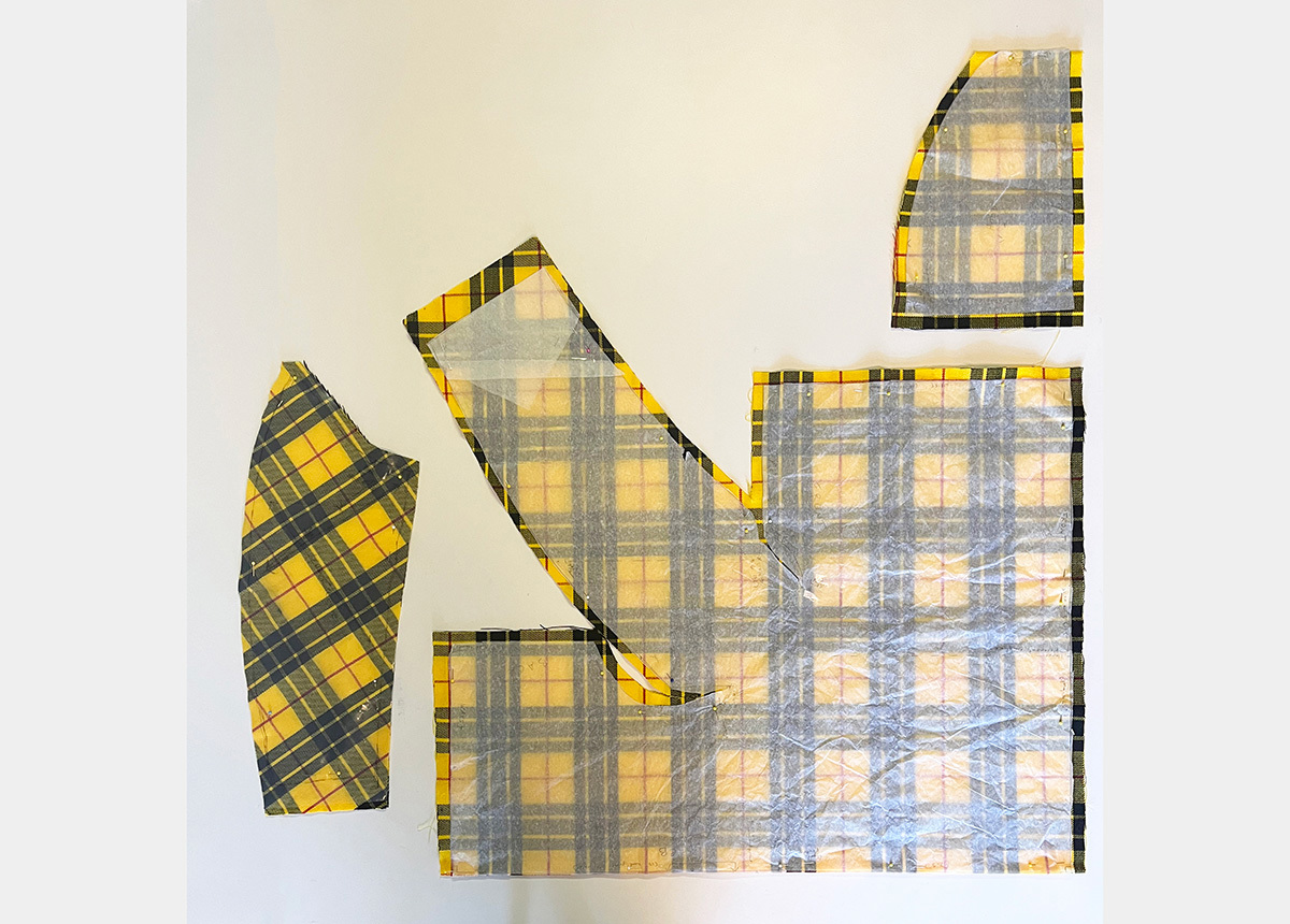 A cut fabric pattern with a yellow plaid design
